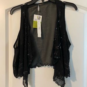 Waistcoat. Sequined. Uneven edge